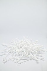 Vertical banner with cotton buds heap isolated on the white copy space background