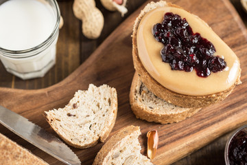 Homemade Healthy Breakfast. Peanut Butter and Jelly on Rustic Wooden Background.