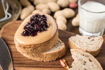 Homemade Healthy Breakfast. Peanut Butter and Jelly on Rustic Wooden Background.