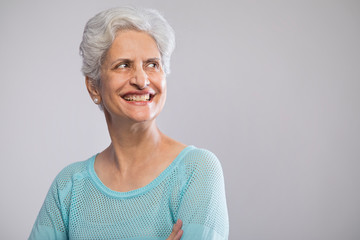 Portrait of confident senior woman smiling	