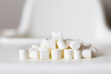 Fototapeta na wymiar marshmallow pyramid. marshmallows on a white background