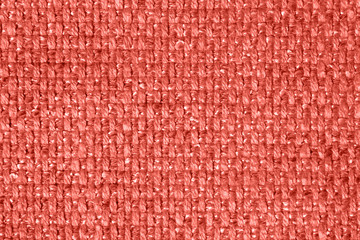 Living Coral color pure linen texture. Living Coral Color 2019 year concept. Wrinkled linen fabric background. Natural linen texture