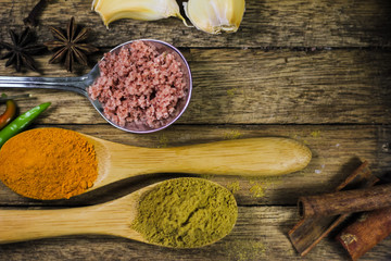 Close up of various asian spices and ingredients on wooden board.
