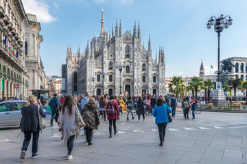 Milan, Italy - March 8, 2019: Milan Cathedral from the square with tourists, Italy