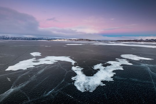 Frozen Lake Tornetrask, snowdrifts, dusk, Abisko National Park, Abisko, Norrbotten, Lapland, Sweden, Europe