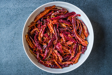 Stack of Dried Red Chili or Chilli Cayenne Pepper in Bowl.