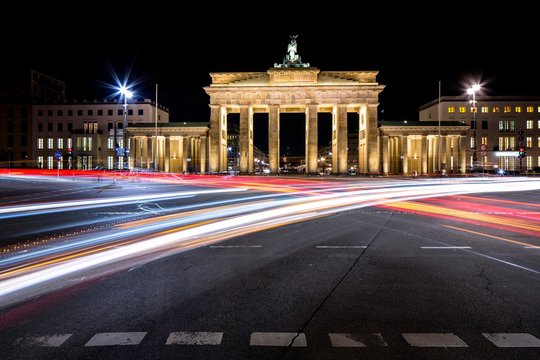 Brandenburg Gate with light trails at night, Berlin, Germany, Europe