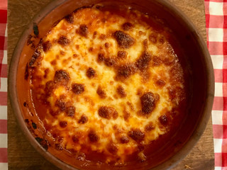 Lasagna with Bechamel Sauce in Casserole at Restaurant.