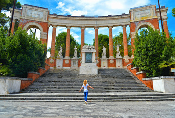 old historical monument to the fallen and to victory with steps, statues and columns in center of...
