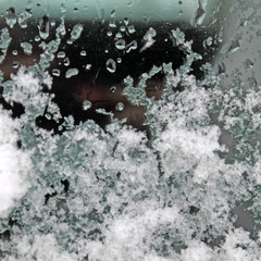 melting snow on the glass. sleet on glass