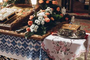golden altar with bible crowns and cross in church before wedding ceremony