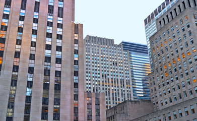 NEW YORK CITY. Detail of Rockefeller Center skyscrapers against blue sky in New York. Rockefeller Center is a complex of 19 commercial buildings. It is a National Historic Landmark.