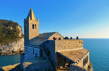 San Pietro church with sea horizon in background, Lord Byron Natural park in Portovenere village on...