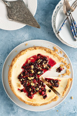 Cheesecake whole. Berry topping. Close view. Copy space.