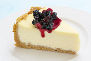 Cheesecake slice. Berry topping. Close view. Copy space.