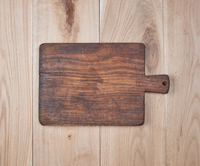 empty old kitchen cutting board on a wooden table