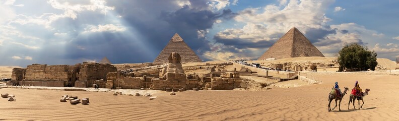 Panorama of the Giza Pyramid complex in Egypt, cloudy day view