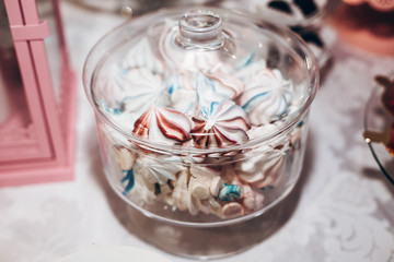 luxury wedding catering, table with modern bizet whipped desserts, cupcakes, sweets with fruits. delicious candy bar at expensive wedding reception. space for text. shower. holiday celebration