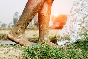 Barefoot walking in mud & water.