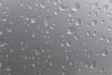 melting snow on the glass. sleet on glass