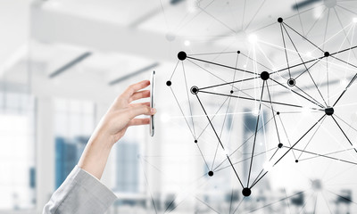 Business and technology concept with networking grid and man using device