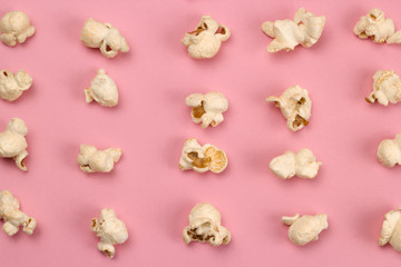 top view food fashion flat lay popcorn on a pink background