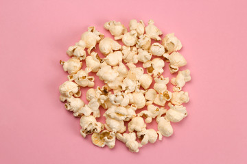 top view food fashion flat lay popcorn circle on a pink background