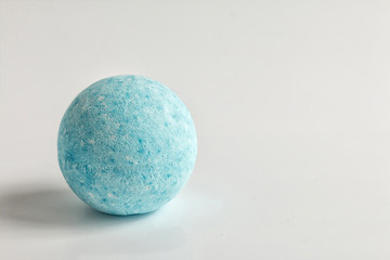 Bath bomb. The foaming aromatic handmade blue bombs on white background. Bath spa accessories. Copy space for text. 