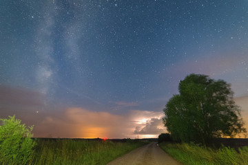 Distant thunderstorm against the starry sk