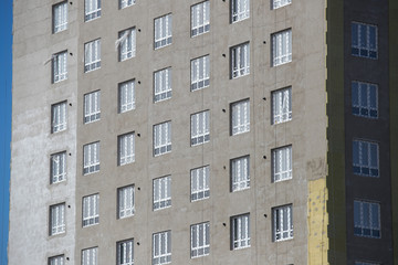  Exterior house wall heat insulation with mineral wool, building under construction.