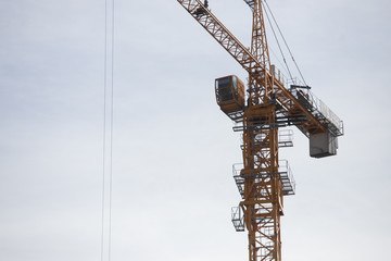 Fototapeta premium Lots of tower Construction site with cranes and building with blue sky background