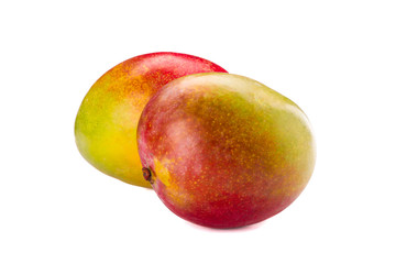 Fresh tropical mangoes isolated on white background