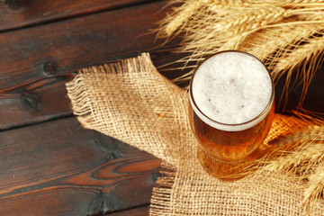 Glass beer on wood background