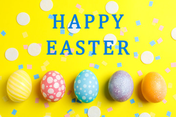 Decorative Easter eggs on color background, space for text. Top view