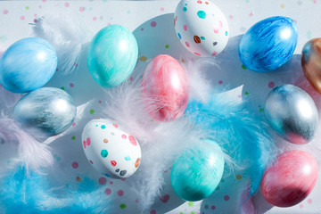 creative coloring of Easter eggs for the holiday in pastel pearl colors. the view from the top.