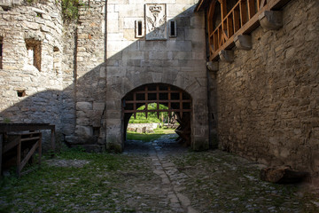 Fototapeta na wymiar Medieval wooden grid gate to ancient castle