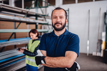 Portrait of warehouse worker looking at camera