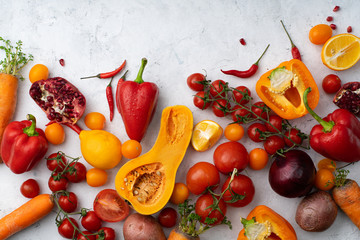 Flatlay with colorful vegetables and copy space arranged on white background. View from above. Vegan nutrition concept