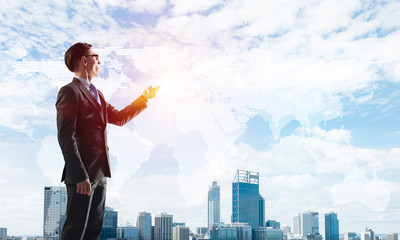 Concept of business success and control with confident boss against cityscape background