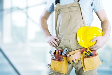 Worker man with helmet on background