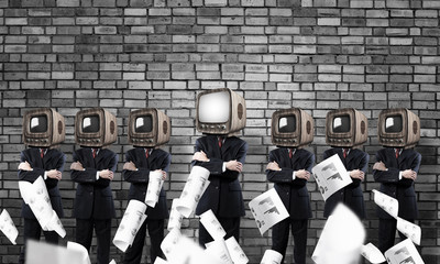 Businessmen with old TV instead of head.