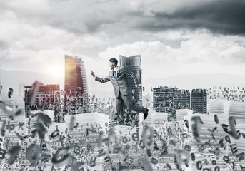 Precise businessman in suit running with phone.