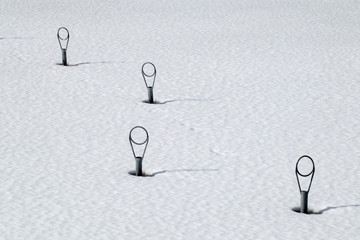 Top of empty mooring buoys at winter, Finland