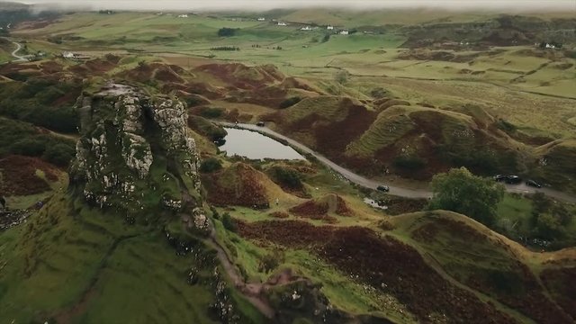 A pull out shot of Castle Ewen in Fairy Glen, Uig in the Scottish Highlands. Aerial. HD