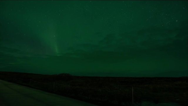 Dramatic pan shows beautiful northern lights in Iceland in February. Shot 4k