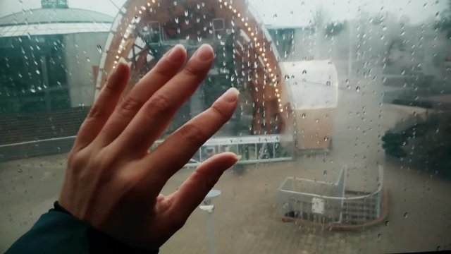 Felame hand putting on glass inside funicular, nice memories impressions, travel concept
