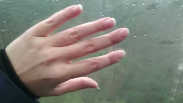 Felame hand putting on glass inside funicular, nice memories impressions, travel concept