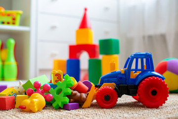Children's playroom with plastic colorful educational blocks toys. Games floor for preschoolers...