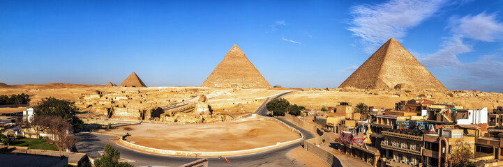 Giza Pyramids and living buildings in front of them, Egypt