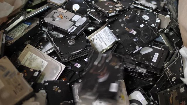 Stack of hard drives designed for recycling. Saving earth from electronic waste